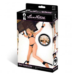 Две пары черных наручников, крепящиеся к матрасу