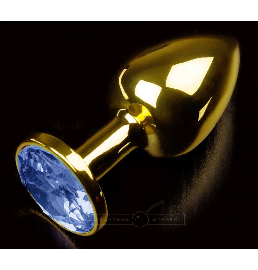 Золотистая анальная втулка с синим стразом - 7 см.