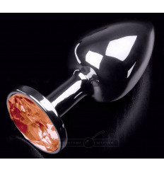 Серебристая анальная пробка с оранжевым кристаллом - 7 см.