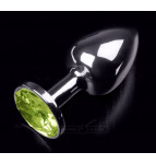 Cеребристая анальная пробка с салатовым кристаллом - 7 см. Cеребристая анальная пробка с салатовым кристаллом - 7 см.