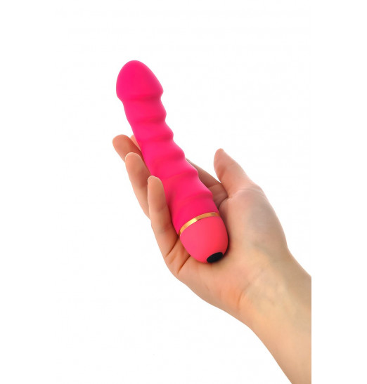 Розовый рельефный вибромассажер - 16 см.