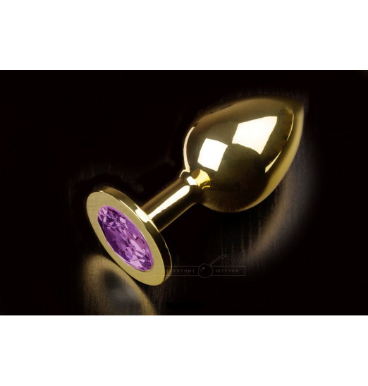 Большая золотая анальная пробка с закругленным кончиком и фиолетовым кристаллом - 9 см. Большая золотая анальная пробка с закругленным кончиком и фиолетовым кристаллом - 9 см.