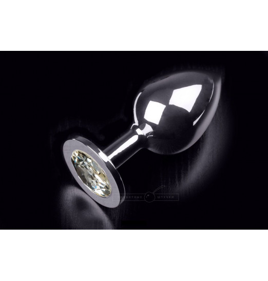 Большая серебристая анальная пробка с круглым кончиком и прозрачным кристаллом - 9 см.