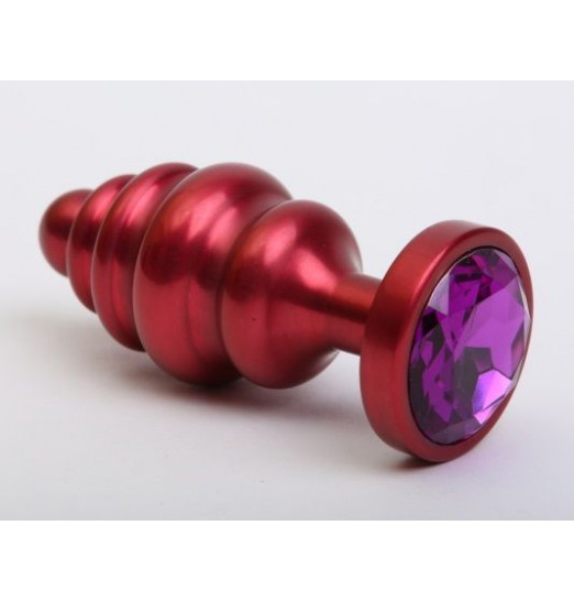 Красная ребристая анальная пробка с фиолетовым стразом - 7,3 см. Красная ребристая анальная пробка с фиолетовым стразом - 7,3 см.