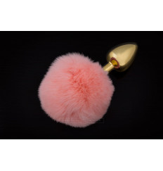 Маленькая золотистая пробка с пушистым розовым хвостиком