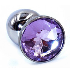 Серебристая анальная пробка с фиолетовым стразом - 7 см.