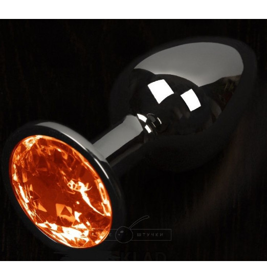 Графитовая анальная пробка с оранжевым кристаллом - 8,5 см.